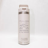 White YETI water bottle with nature-themed design and 'It's All Good in the Woods' text on a white background