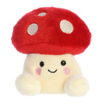 Plush toy shaped like a mushroom with a red cap and white body on a white background