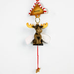 Decorative moose ornament with wings and 'Montana' sign on a white background