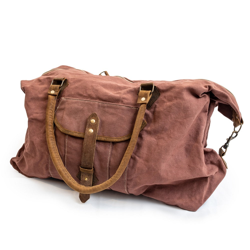The Antique Rust Canvas Duffle Bag by Sugarboo and Co is the perfect travel companion.