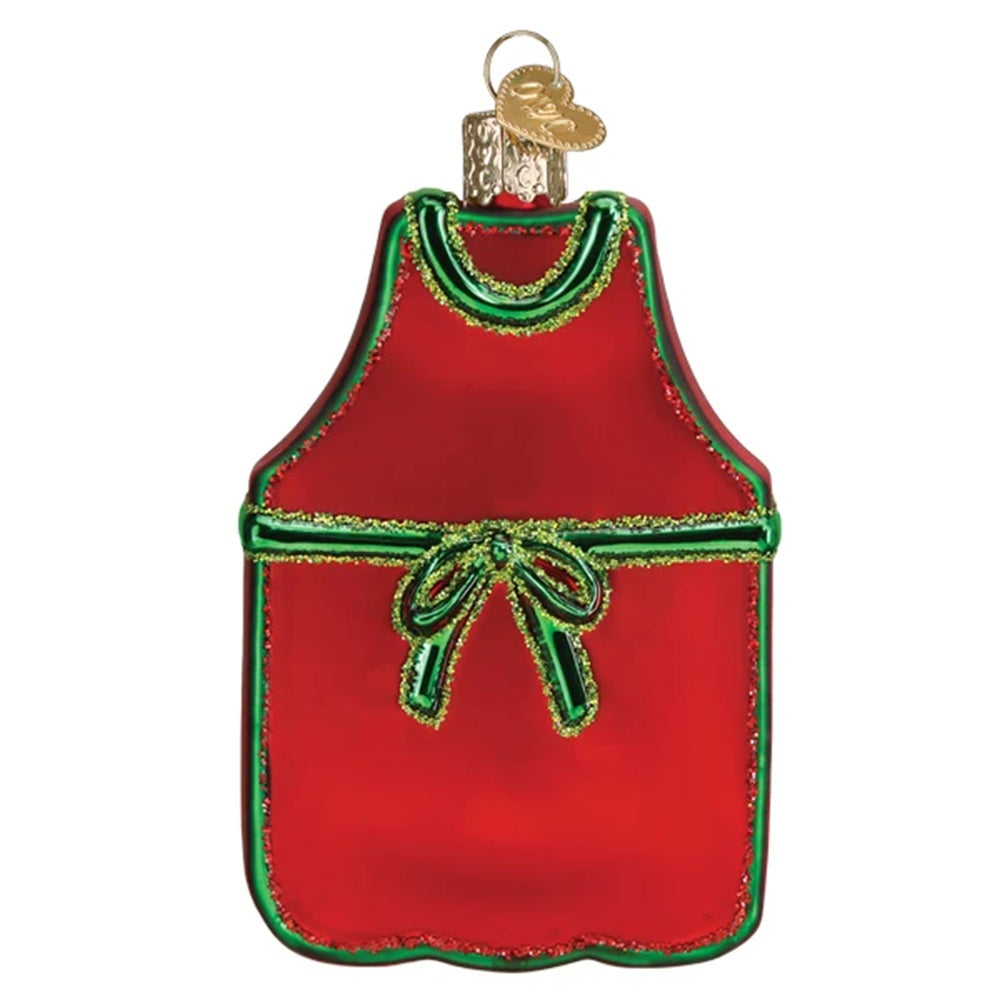 Red apron ornament with green trim on a white background