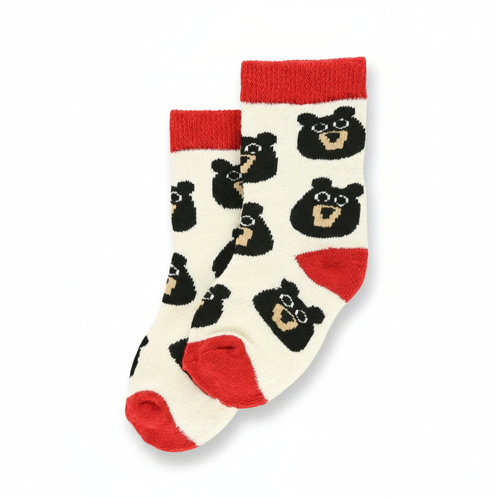 Children's socks with bear pattern and red accents on a white background