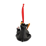 Black bear ornament with red ribbon on a white background