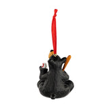 Black bear ornament with red ribbon on a white background