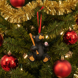 Black bear ornament with a red ribbon on a white background