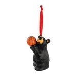 Black bear ornament holding an orange basketball on a white background
