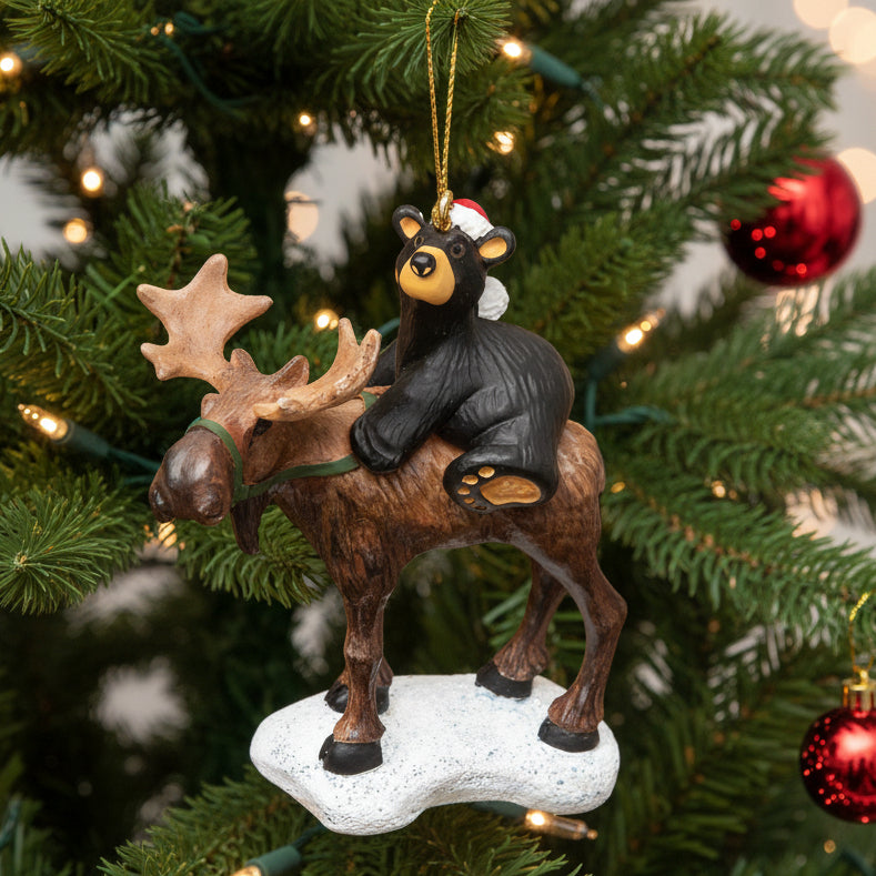 Celebrate the Holidays with a native Montanan, Jeff Fleming, and his cute Bearfoootos Bear Riding Moose Ornament. 