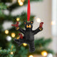 Black bear ornament with red birds on a white background