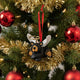 Black bear ornament with angel wings and a red ribbon on a white background