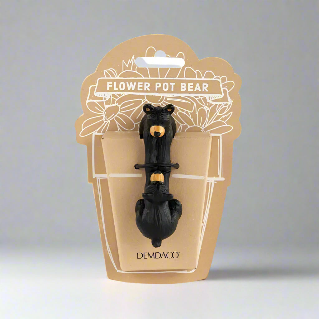 Black bear figurine in a flower pot with 'Flower Pot Bear' packaging on a white background