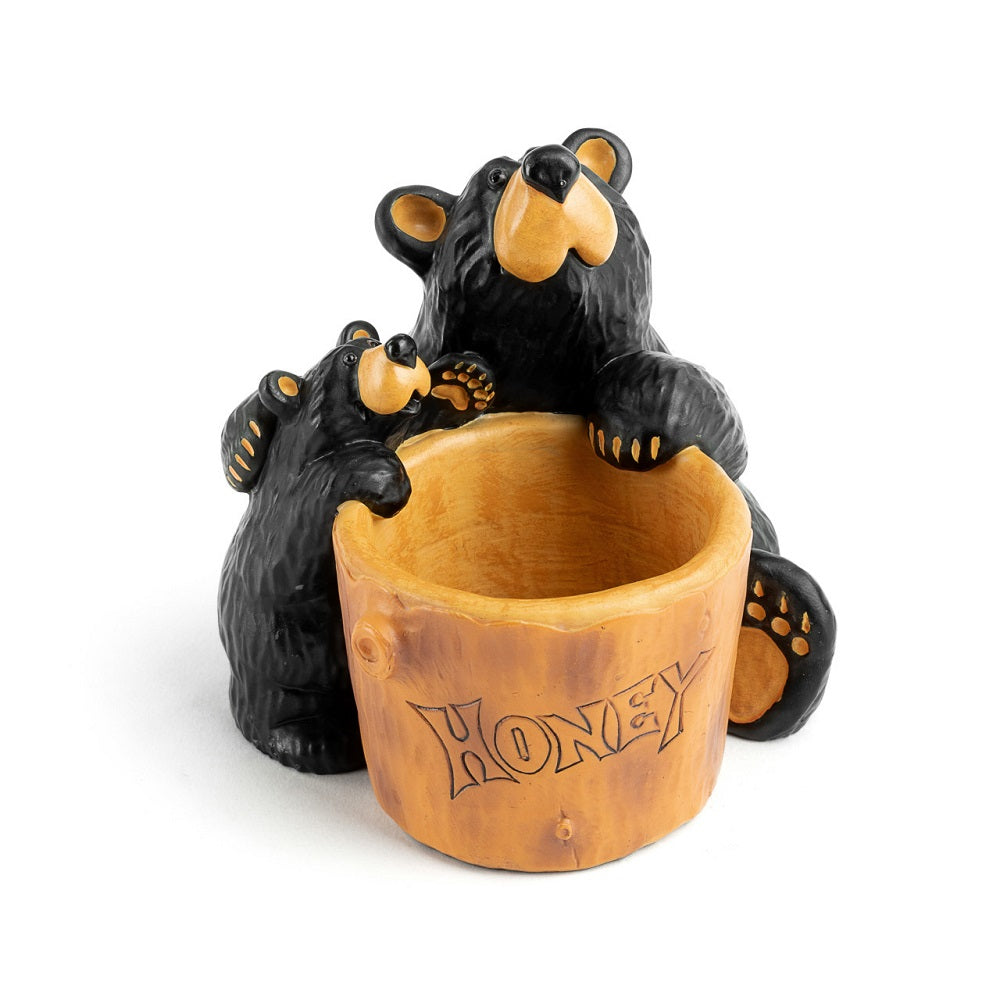 Two Bearfoots Bears embracing near a large wooden pot labeled 'honey'. Resin Bearfoots Honey Pot Paper Clip Holder by Demdaco