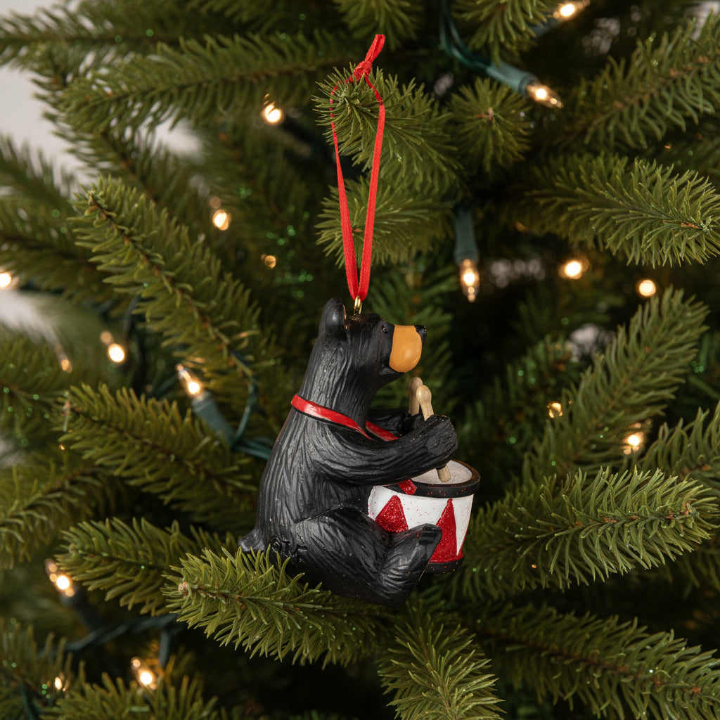 Bearfoots bear playing a drum Christmas ornament with a red ribbon
