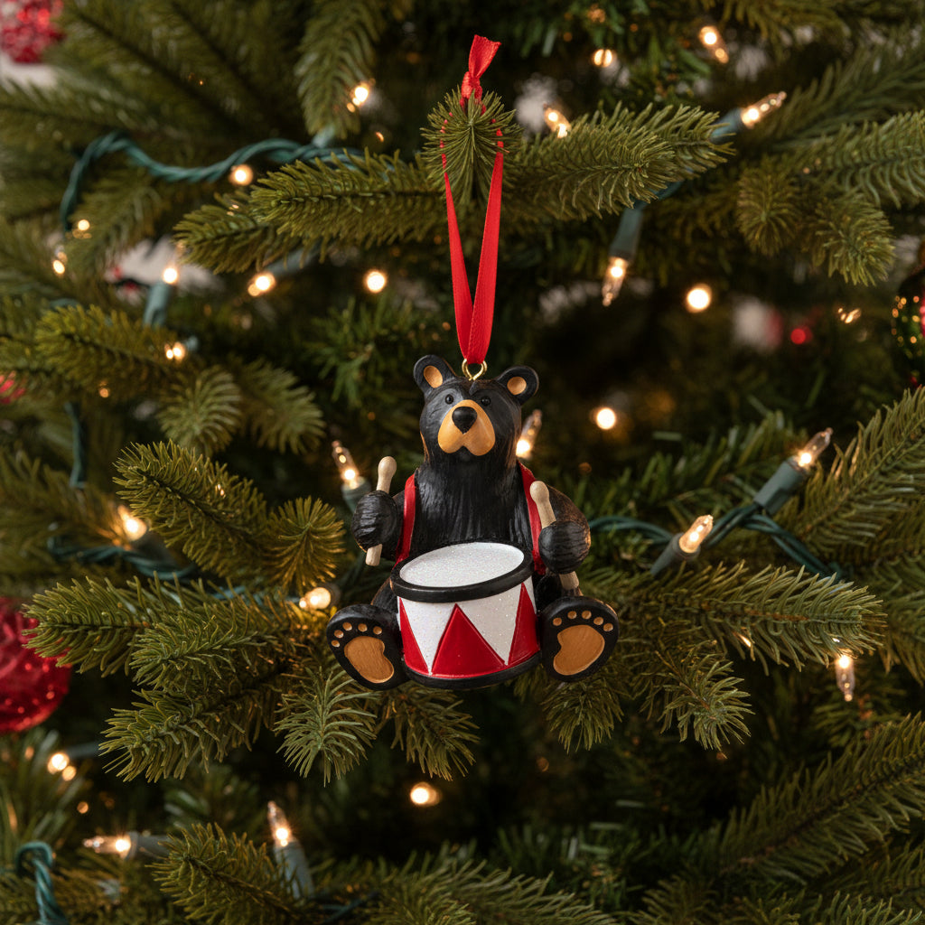 Decorative Bearfoots bear ornament with drum and red ribbon