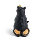 Black bear statue with a cub on a white background
