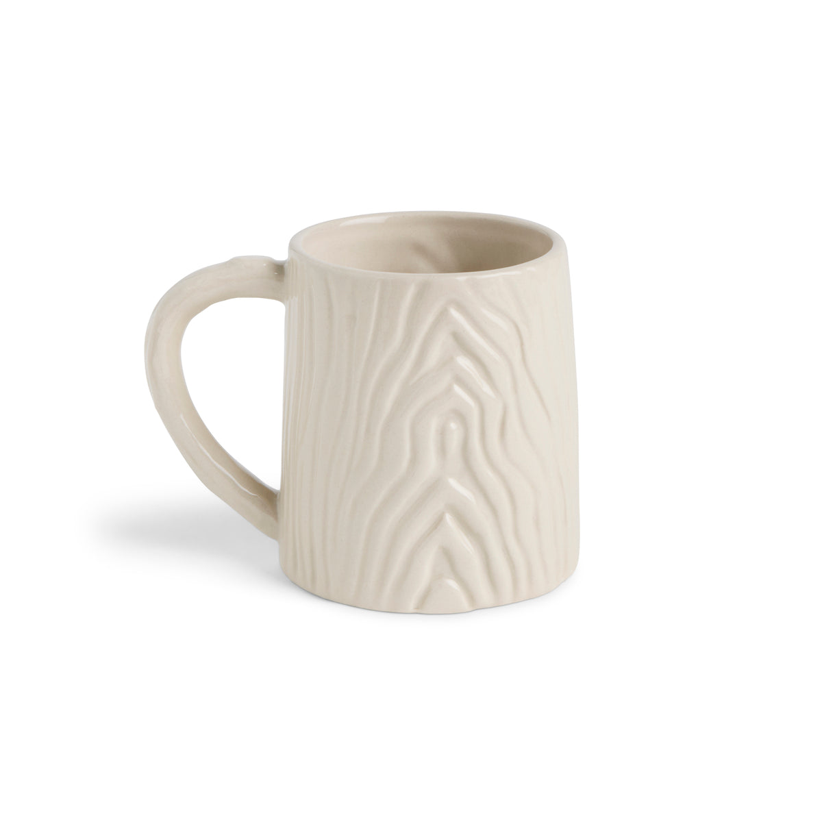 White ceramic mug with textured design on a white background