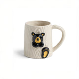 White mug with Bearfoots bear design on a white background