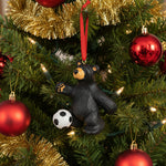 Black bear ornament with a soccer ball on a white background