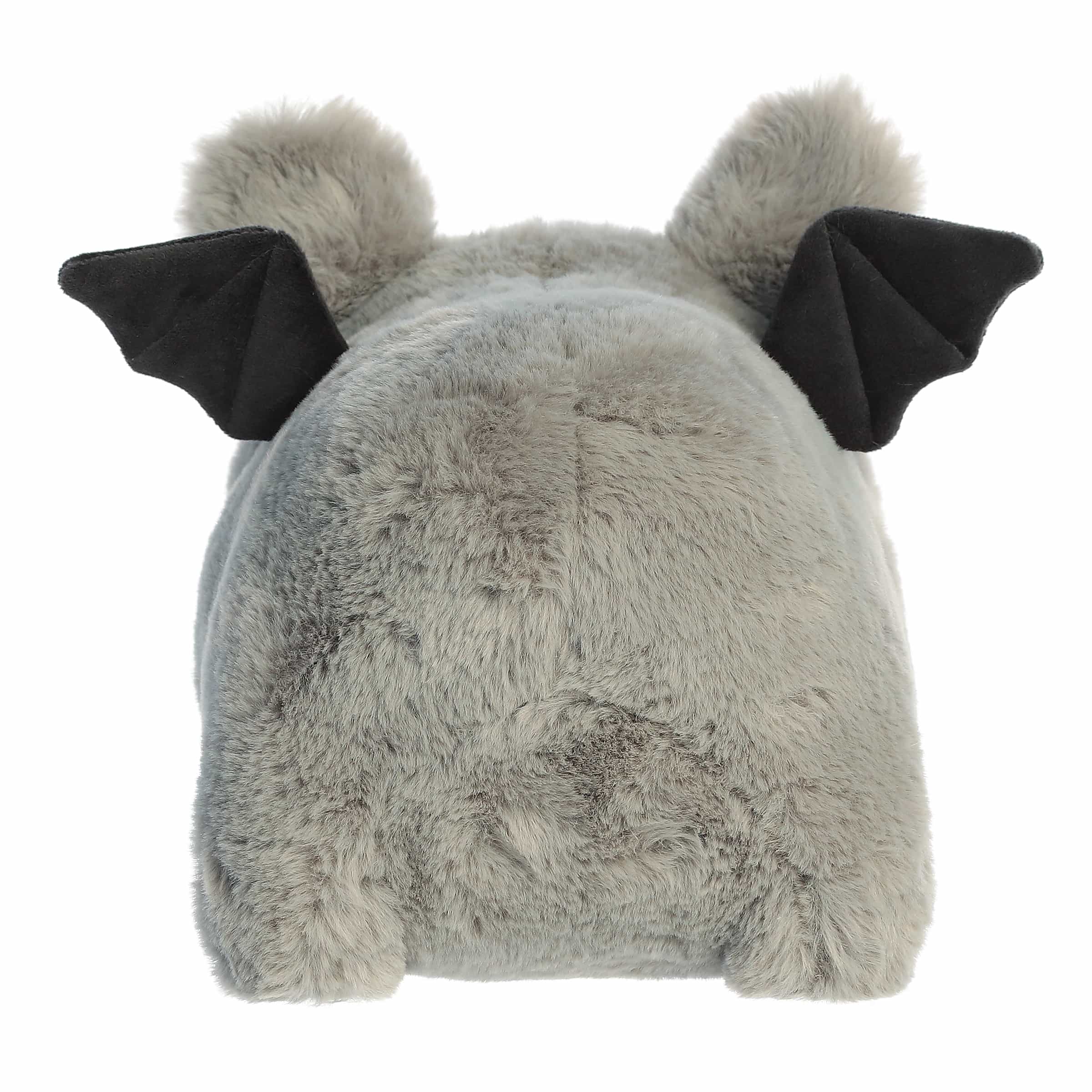 Plush toy with bat-like features on a white background