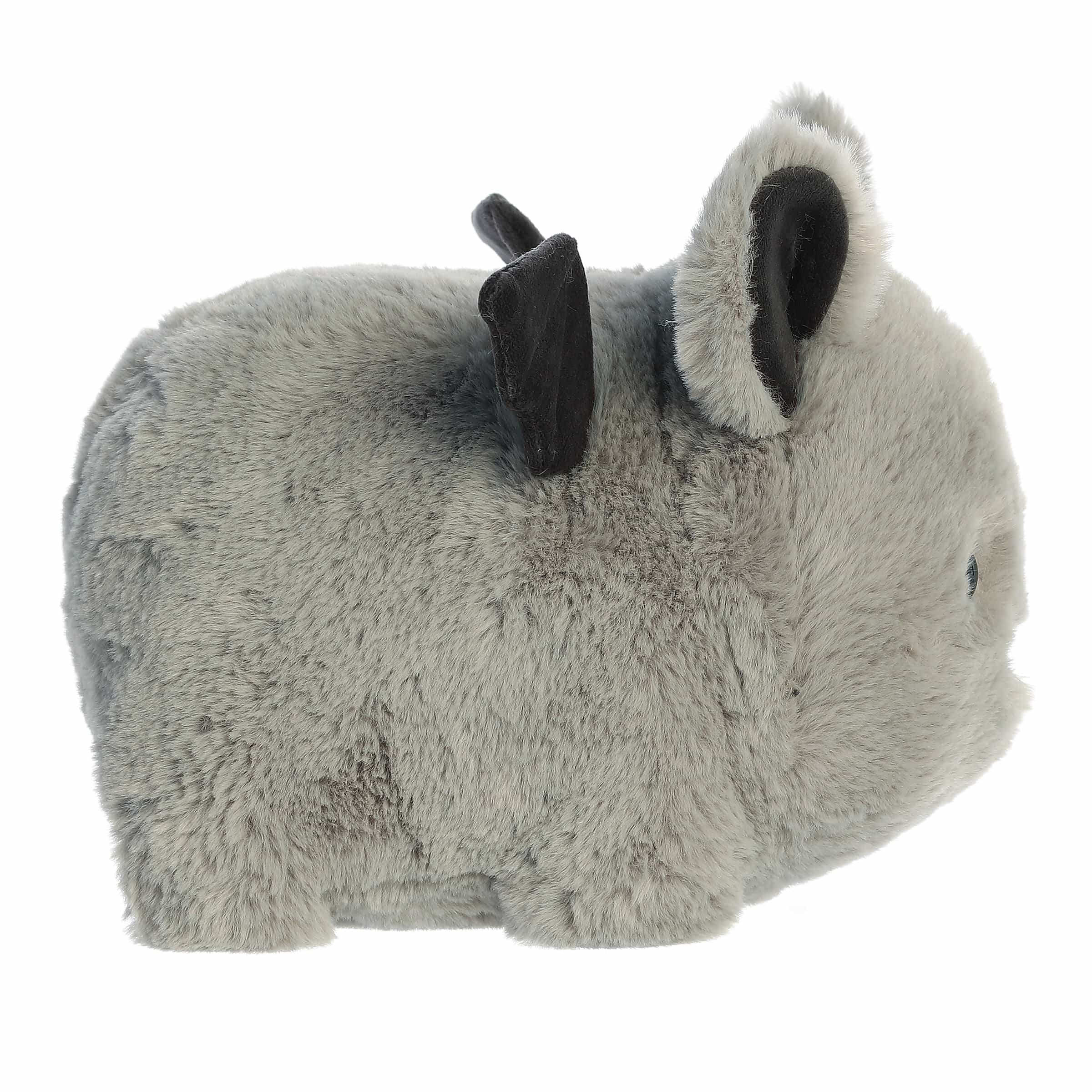 Plush toy with bat-like features on a white background