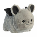 Plush toy with bat-like features on a white background