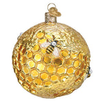 Decorative ornament resembling a honeycomb with a bee on a white background