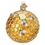Decorative ornament resembling a honeycomb with bees on a white background