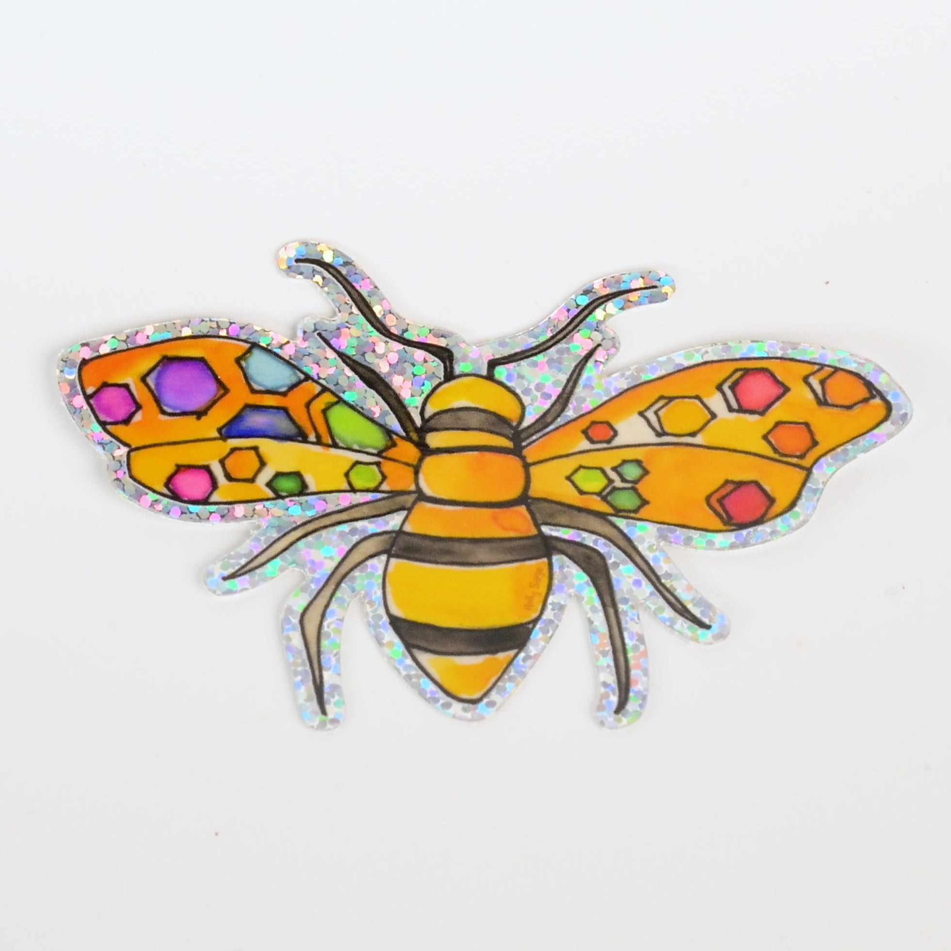 Colorful bee-shaped sticker with iridescent wings on a white background