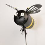 Bee-shaped art with black and yellow colors on a white background