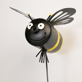 Bee-shaped art with black and yellow colors on a white background