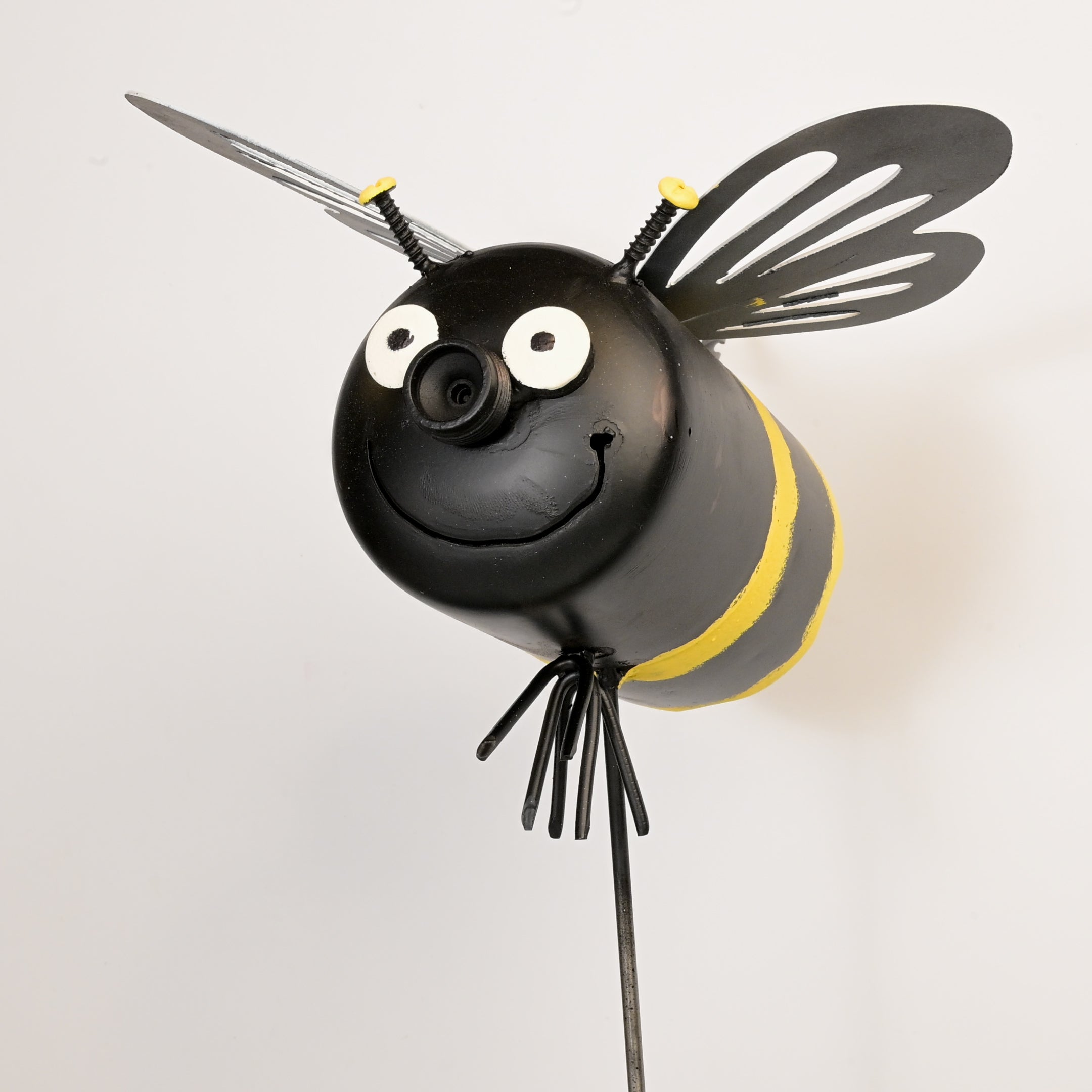 Bee-shaped art with black and yellow colors on a white background