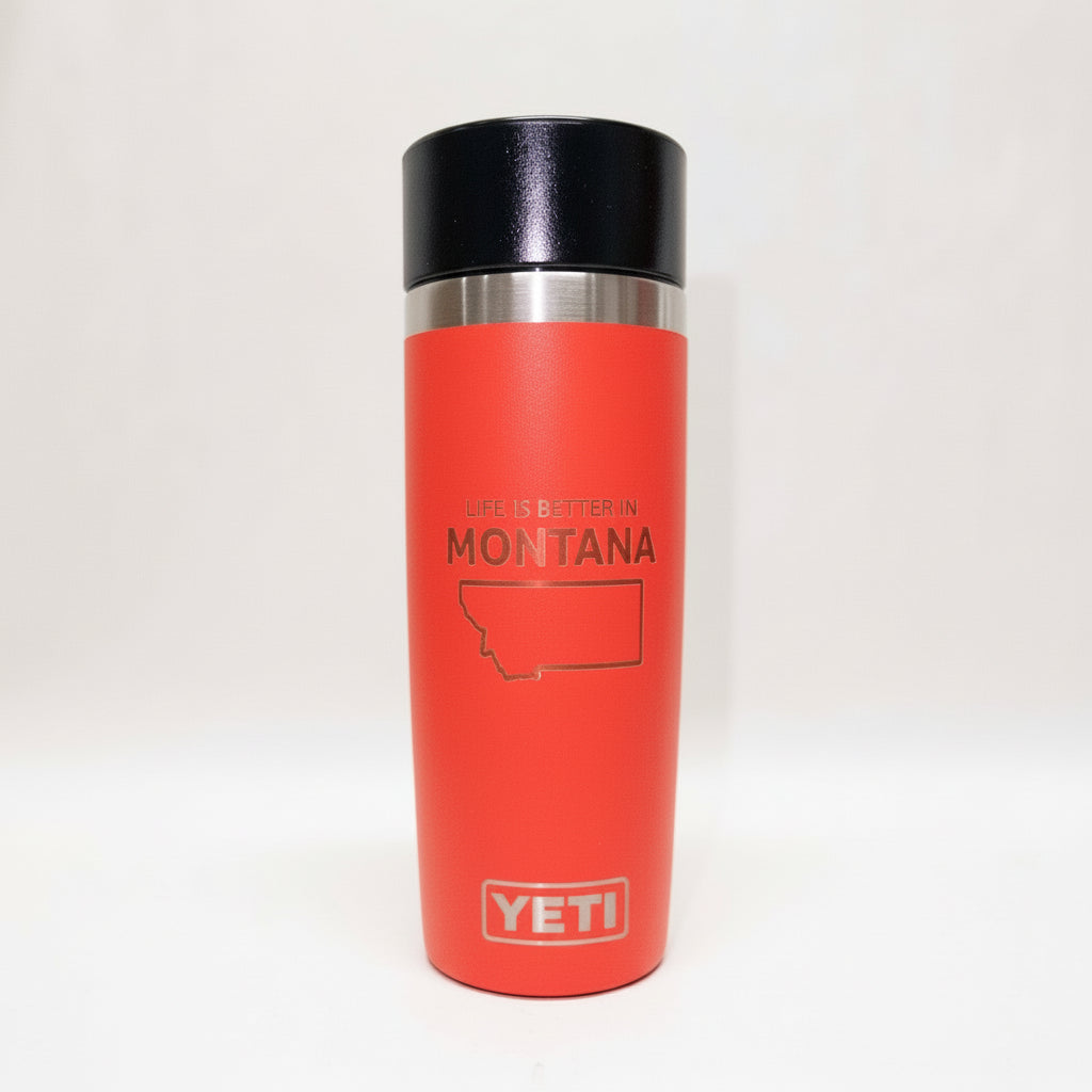 Red YETI mug with 'Life is better in Montana' text on a white background