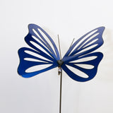 Blue butterfly-shaped decorative object on a white background