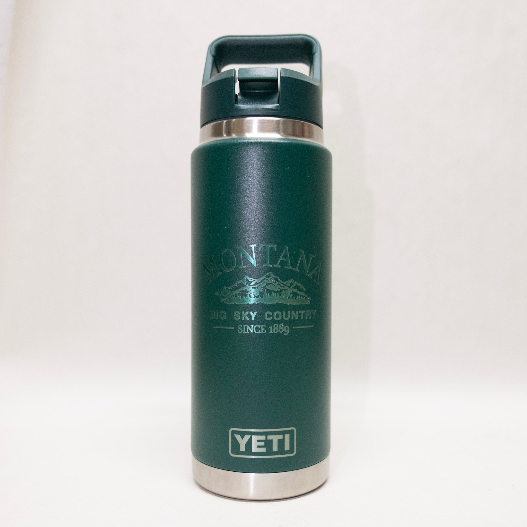 Green YETI water bottle with Montana design on a white background