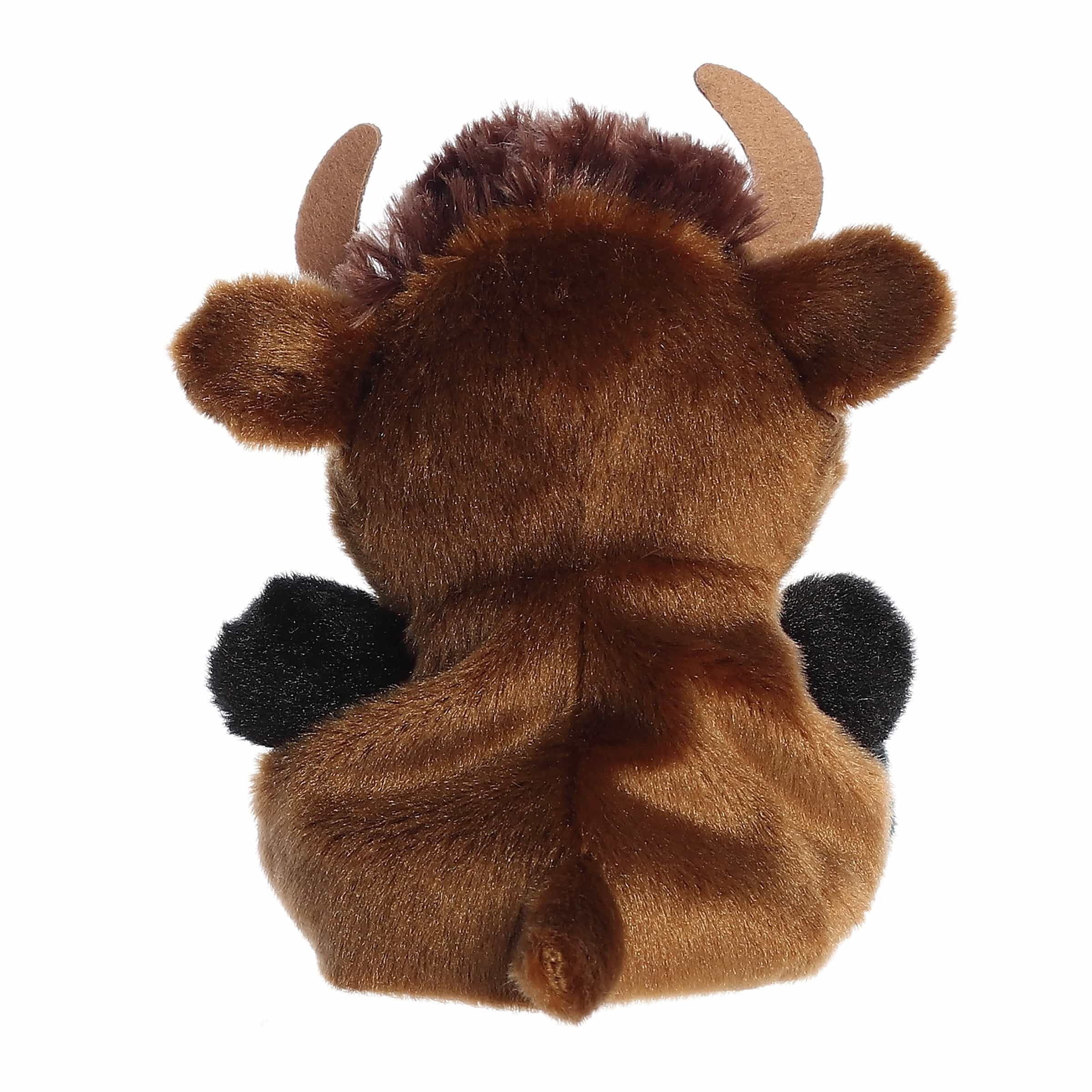 Plush toy bison with brown fur, black hooves, and tan horns on a white background