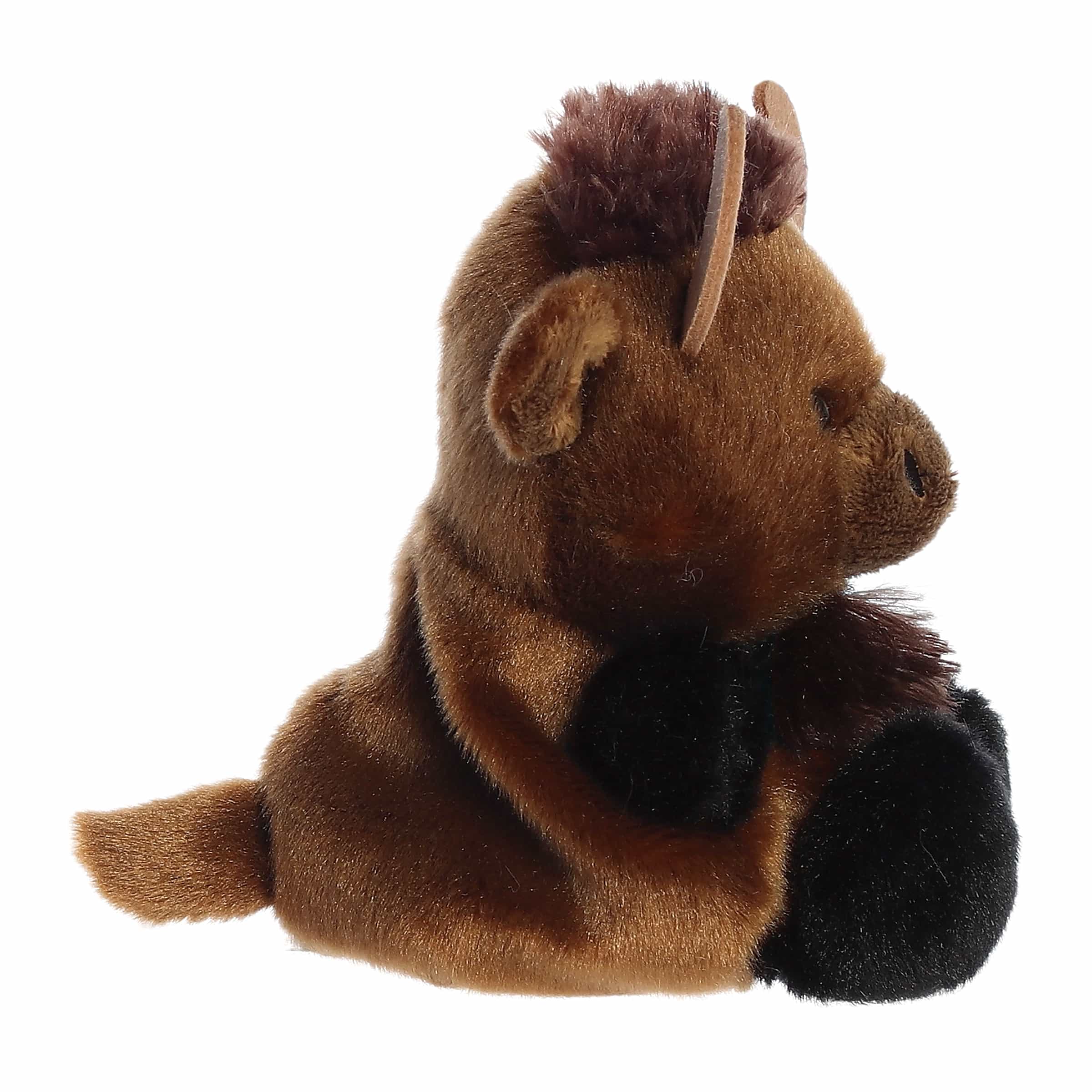 A plush toy bison sitting down, featuring brown fur with black accents on the feet and a dark brown mane, set against a plain white background.