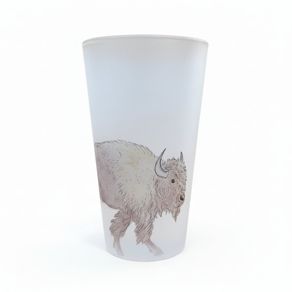 A frosted glass tumbler featuring a detailed line art illustration of a bison, displayed on white background.