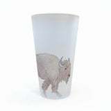 A frosted glass tumbler featuring a detailed line art illustration of a bison, displayed on white background.