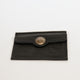 Black leather wallet with a metal clasp on a white background