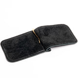A black felt money clip with white stitching and a gold metal clip, shown open on a white background.