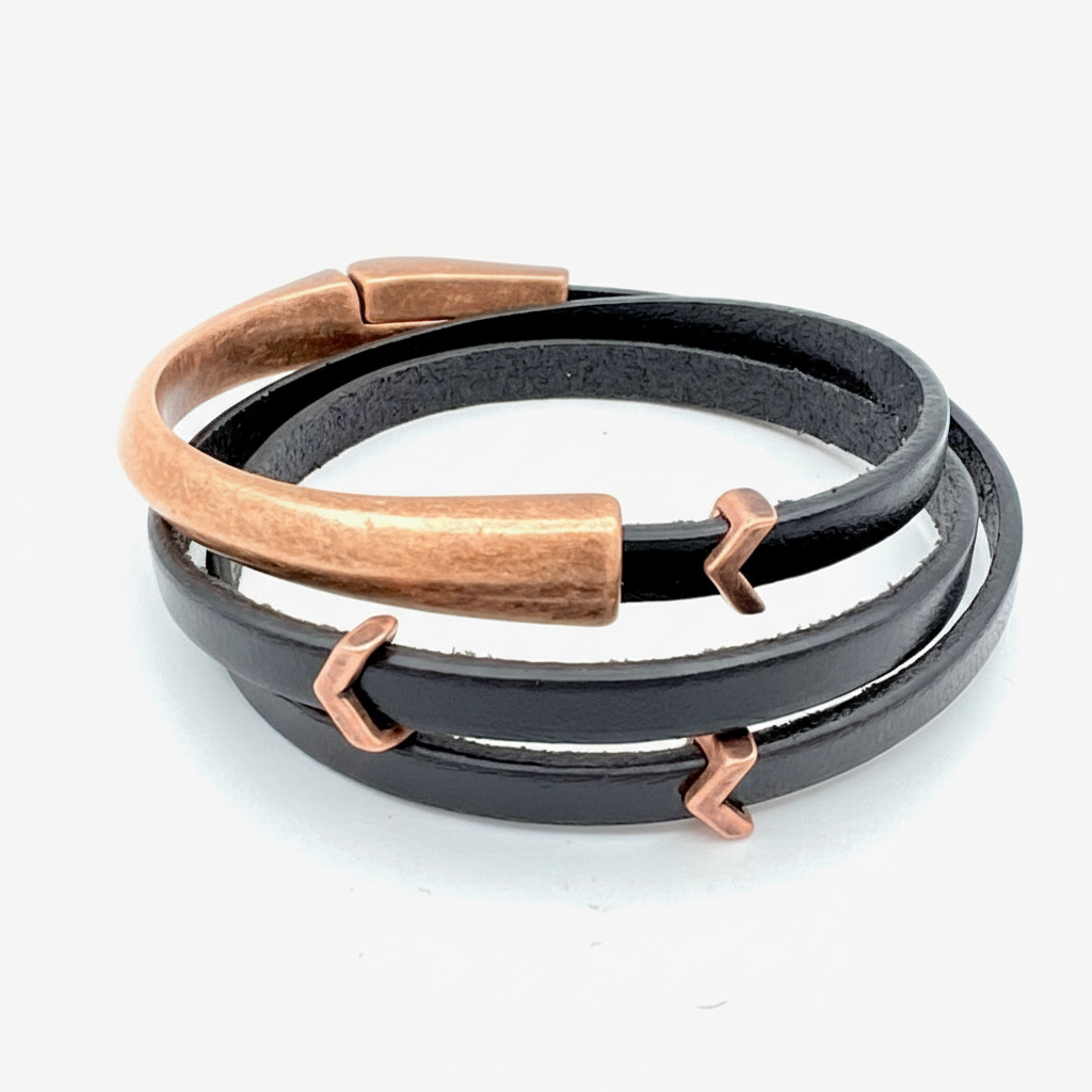 Black leather bracelet with rose gold accents on a white background