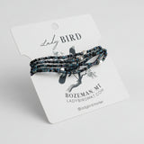 Set of beaded bracelets on a 'Lady Bird' branded card with a gray background