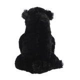 Plush black bear toy on a white background