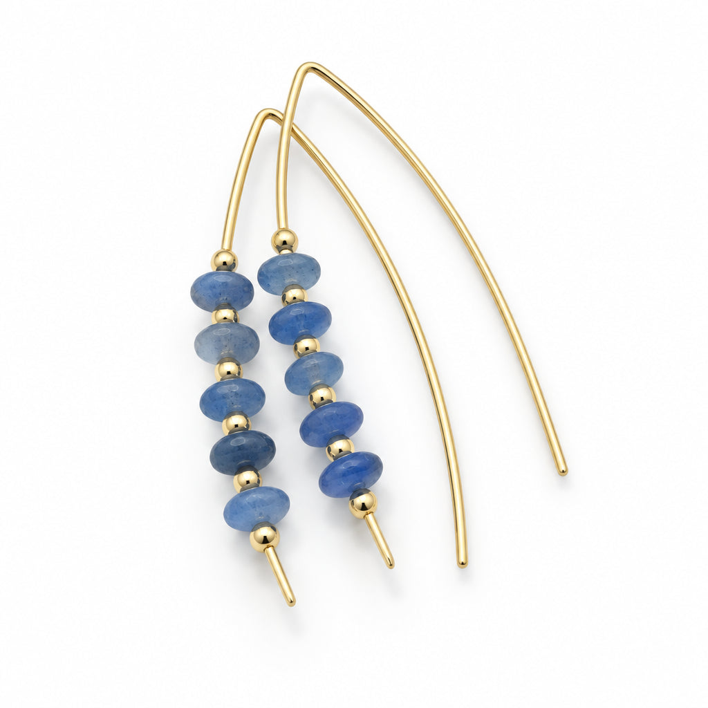 Gold-tone dangle earrings with small blue faceted beads, displayed on a white background.