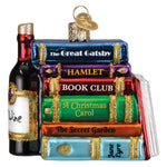 Decorative ornament resembling a stack of books with titles and a wine bottle.