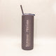 Gray tumbler with 'Bozeman, Montana' text on a beige background