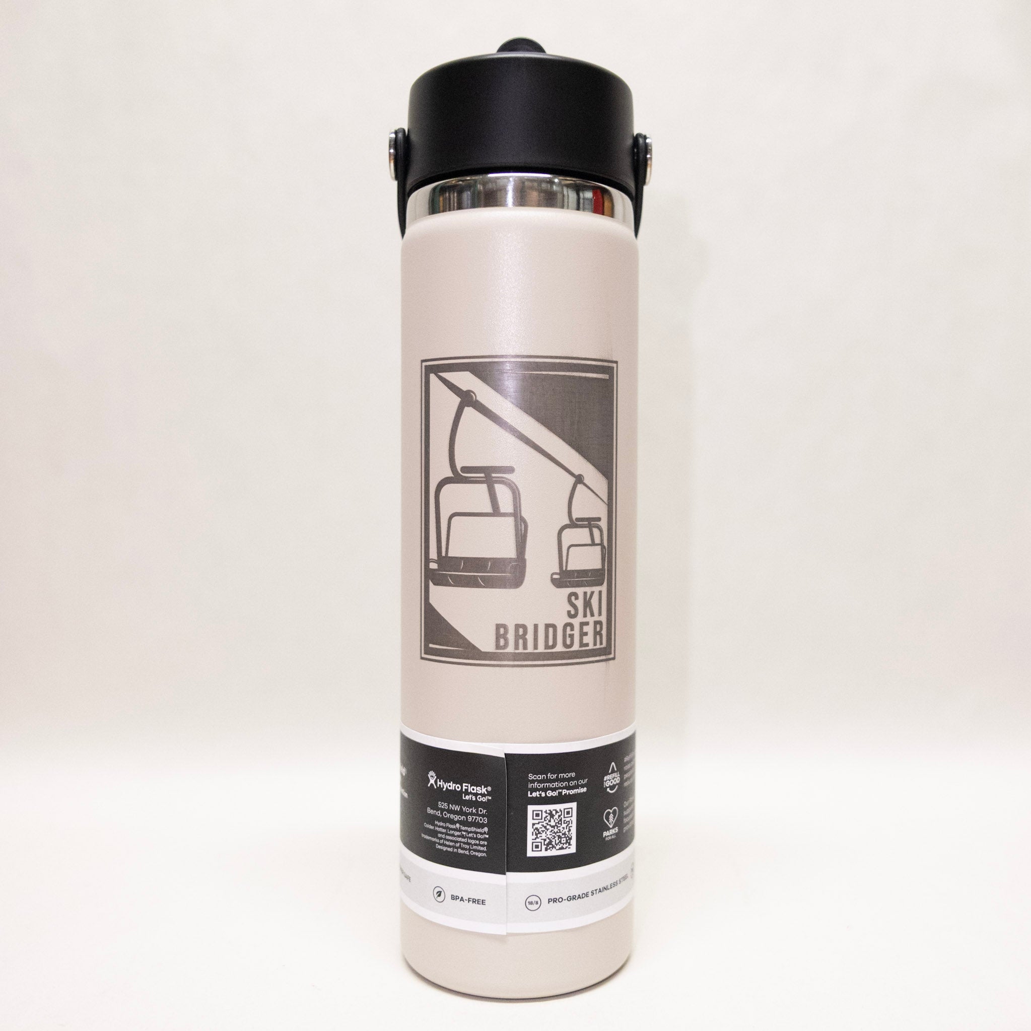White water bottle with black lid and 'Ski Bridger' logo on a white background