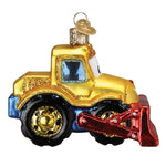 Decorative glass ornament of a bulldozer on a white background