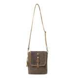 Brown leather crossbody bag with a strap on a white background