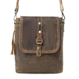 Brown leather crossbody bag with metal buckle on a white background
