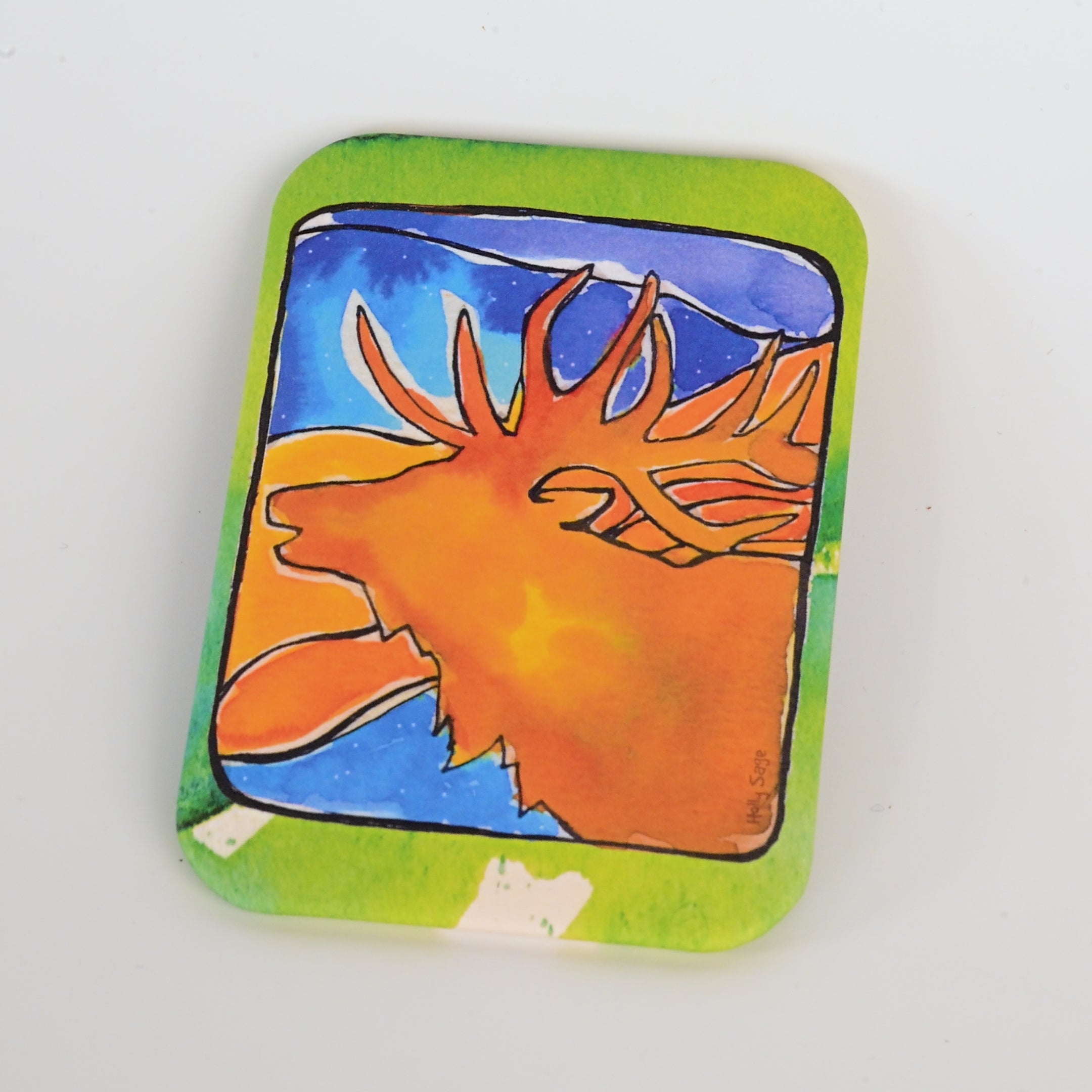 Colorful magnet with a elk design on a white background